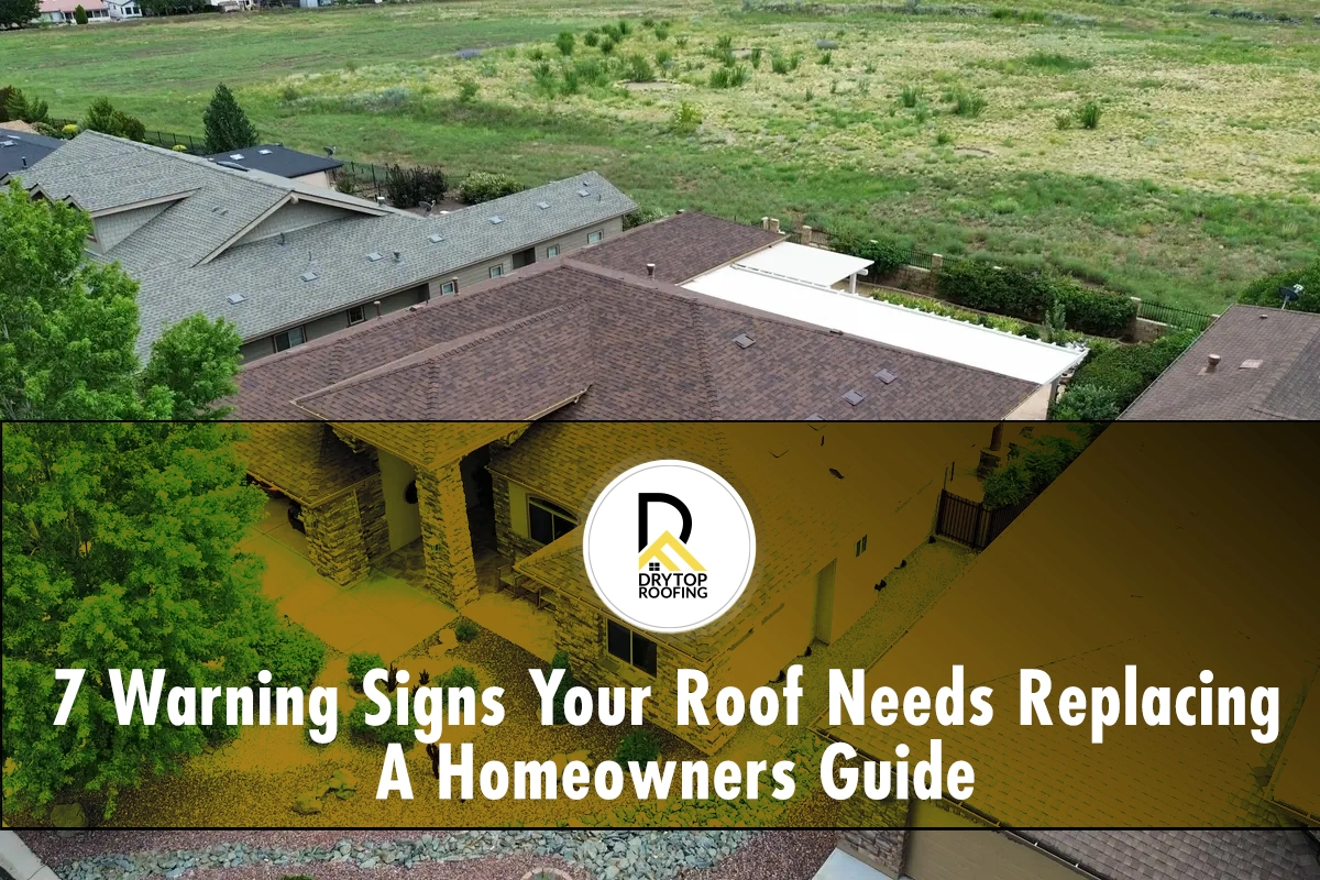 SIgns your roof needs replacing: gray shingle roof on a large home with visible ridges and valleys